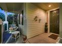 Cozy front porch featuring a hanging swing and a view of the home's entrance at 5513 Flowering Meadows Ave, Las Vegas, NV 89131