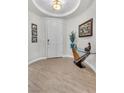 Inviting entryway with wood-look tile flooring and stylish decor at 69 Via Di Mello, Henderson, NV 89011