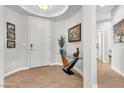 Bright entryway with wood-look tile flooring and modern decor at 69 Via Di Mello, Henderson, NV 89011