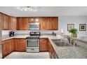 Bright kitchen with granite countertops, stainless steel appliances, and ample storage space at 7950 W Flamingo Rd # 1044, Las Vegas, NV 89147
