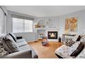 Comfortable living room features a cozy fireplace, bright window, and neutral paint to suit any decor at 7950 W Flamingo Rd # 1044, Las Vegas, NV 89147