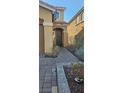 The home's facade with a brick walk way leads to a welcoming front entrance at 8117 Discovery Point St, Las Vegas, NV 89139