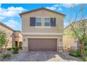 Charming two-story home with a well-manicured lawn and a two-car garage at 9176 Bluebell Knoll Ct, Las Vegas, NV 89178