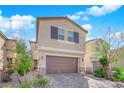 Charming two-story home with a well-manicured lawn and a two-car garage at 9176 Bluebell Knoll Ct, Las Vegas, NV 89178