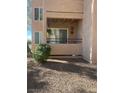 A private balcony with a sun decoration, small plants and curtains creates a cozy outdoor space at 9325 W Desert Inn Rd # 174, Las Vegas, NV 89117