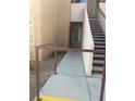 Walkway leading to unit features secure railing and concrete steps at 9325 W Desert Inn Rd # 174, Las Vegas, NV 89117