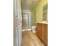 Bathroom featuring a shower with sliding glass doors, toilet, and a light wood vanity at , Las Vegas, NV 89103