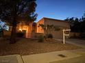 Inviting single-story home features desert landscaping and a convenient attached two-car garage at 11031 Mission Lakes Ave, Las Vegas, NV 89134