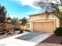 Spacious home featuring a two-car garage and a well-maintained driveway at 11031 Mission Lakes Ave, Las Vegas, NV 89134