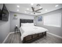 Bright bedroom features a ceiling fan and hardwood floors at 120 Chartan Ave, Las Vegas, NV 89183