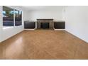 Neutral living room with fireplace and built in cabinets at 132 Montclair Dr, Henderson, NV 89074