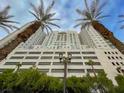 An upward view of a high-rise building with palm trees at 150 Las Vegas Blvd # 918, Las Vegas, NV 89101