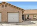 Charming home exterior with a one-car garage, a welcoming front entrance, and desert-style landscaping at 209 Crosswind Way, Las Vegas, NV 89145