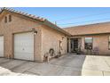 Attractive exterior view of a single-story home with a garage, welcoming front porch, and well-maintained landscaping at 209 Crosswind Way, Las Vegas, NV 89145