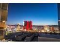 Expansive cityscape with iconic buildings, viewed from an elevated vantage point at dusk at 2877 Paradise Rd # 2704, Las Vegas, NV 89109