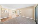 Spacious living room with plush carpeting and natural light, perfect for relaxation at 3123 Key Largo Dr # 101, Las Vegas, NV 89120