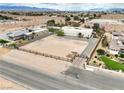 An aerial view of the property, revealing its spacious 1.07-acre lot in a desert landscape at 3910 W Pebble Rd, Las Vegas, NV 89139
