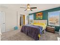 Comfortable bedroom with carpet flooring, ensuite bath and bright natural light at 4352 Browns Creek Ave, North Las Vegas, NV 89084