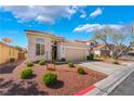 Inviting single-story home featuring a manicured front yard and a spacious driveway leading to an attached garage at 4631 Forest Shadow Ave, Las Vegas, NV 89139