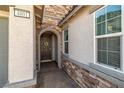 Inviting front entrance features stone accents, decorative wreath, and brick pathway leading to the door at 4801 Westmont Dr, Pahrump, NV 89061