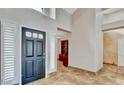 Elegant entryway showcases high ceilings and sleek tile floors, leading into the rest of this beautiful home at 5010 Longboat Cir, Las Vegas, NV 89113