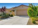Charming single-story home with a well-maintained front yard and a two-car garage at 5327 Progresso St, Las Vegas, NV 89135