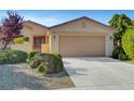 Charming single-story home with a well-maintained front yard and a two-car garage at 5327 Progresso St, Las Vegas, NV 89135