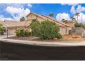 Sideways shot of single-story house with desert landscaping and a 'For Sale' sign, perfect for potential buyers at 5513 Oakview Falls Ct, Las Vegas, NV 89148