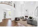 Bright, airy living room with soaring ceilings, fireplace, and elegant finishes at 8429 Brackenfield Ave, Las Vegas, NV 89178