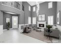 Bright, airy living room with soaring ceilings, fireplace, and elegant finishes at 8429 Brackenfield Ave, Las Vegas, NV 89178
