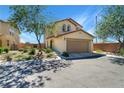 Inviting two-story home with a well-maintained front yard and attached two-car garage at 8853 Autumn Teal Ave, Las Vegas, NV 89178