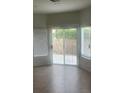 Bedroom with tan floors and windows overlooking the backyard at 9162 Weeping Hollow Ave, Las Vegas, NV 89178