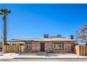 Charming single-story home with brick accents, desert landscaping, and a fenced yard at 1642 E St, Las Vegas, NV 89106