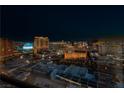 Striking nighttime view of city skyline with lights and various prominent hotels and attractions at 2000 Fashion Show Dr # 5300, Las Vegas, NV 89109