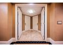 Hotel hallway with textured walls and doors leading to adjacent rooms at 2000 N Fashion Show Dr # 4301, Las Vegas, NV 89109