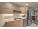 Modern kitchenette featuring stainless steel appliances and sleek countertops at 205 E Harmon Ave # 1007, Las Vegas, NV 89169