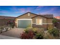 Beautiful single-story home featuring desert landscaping and a two-car garage with decorative stone accents at 2091 Hunt Woods Ct, Laughlin, NV 89029