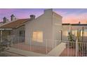 Exterior of townhome with desert landscaping and white picket fence at 2146 High Dunes Ln, Laughlin, NV 89029