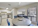 Bright dining area adjacent to kitchen and living room with nice flooring and natural light at 3151 Soaring Gulls Dr # 1192, Las Vegas, NV 89128