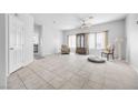 Inviting living room with tile flooring, natural light, and adjacent access to kitchen at 367 Lander Dr, Henderson, NV 89074