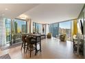 Open living space with a dining table and floor-to-ceiling windows offering city views at 3722 Las Vegas Blvd # 1908, Las Vegas, NV 89158