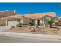 Inviting single-story home boasting a well-kept front yard with mature landscaping and tiled roof at 3961 Equinox Ct, Las Vegas, NV 89147