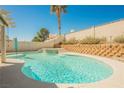 Sparkling pool featuring a tanning deck, palm tree, and surrounding patio space at 3961 Equinox Ct, Las Vegas, NV 89147