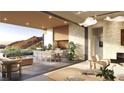 An open-concept space featuring a firepit, dining area, and mountain views at 4 Kaya Canyon Way # 15, Henderson, NV 89012