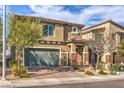 Charming two-story home with a two-car garage, landscaped front yard, and inviting curb appeal at 4442 Solitude Falls Ave, North Las Vegas, NV 89084