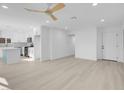Open-concept layout showcasing the bright living room and updated kitchen with new floors at 4629 Alta Dr, Las Vegas, NV 89107
