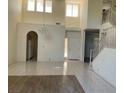 Bright foyer with tile floors, staircase, chandelier, and high ceilings creating an open and welcoming space at 5041 Mount Pleasant Ln, Las Vegas, NV 89113
