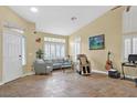 Bright living room with tile flooring, neutral walls, and plenty of natural light at 5835 Farmhouse Ct, Las Vegas, NV 89141