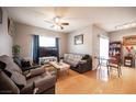 Comfortable living room with hardwood floors, ceiling fan, and cozy furnishings at 6650 W Warm Springs Rd # 1079, Las Vegas, NV 89118