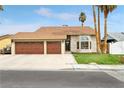 Inviting single-Gathering home with a well-manicured lawn and a three-car garage at 6712 Kittery Dr, Las Vegas, NV 89107